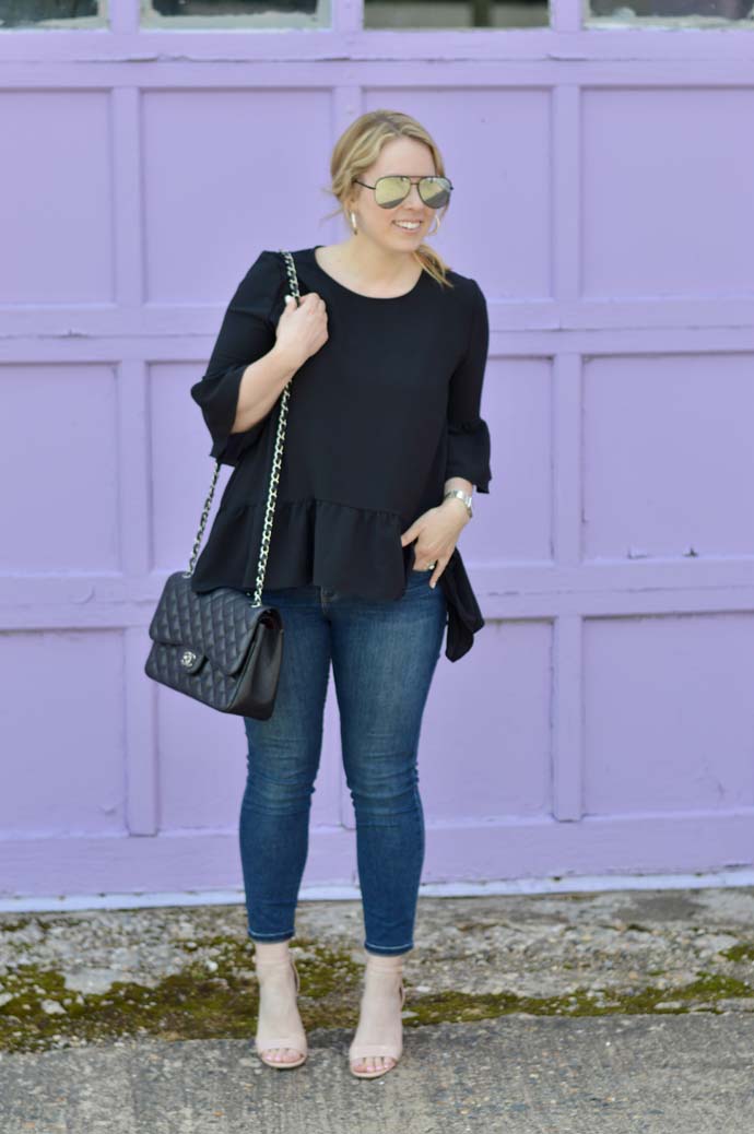 black peplum top and skinny jeans