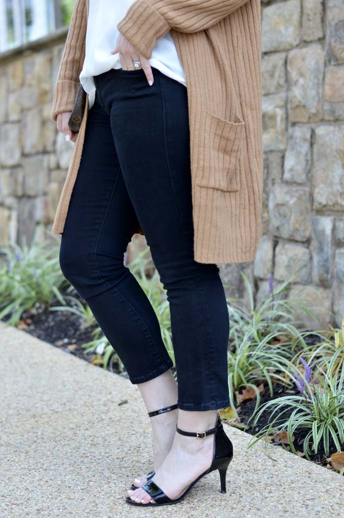 camel sweater black cropped jeans