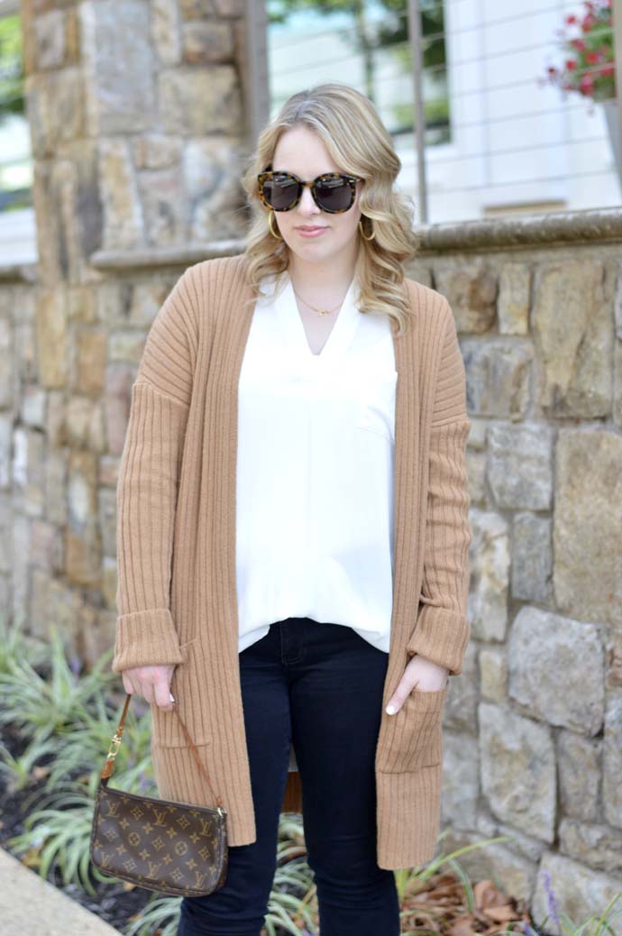 camel sweater white top outfit