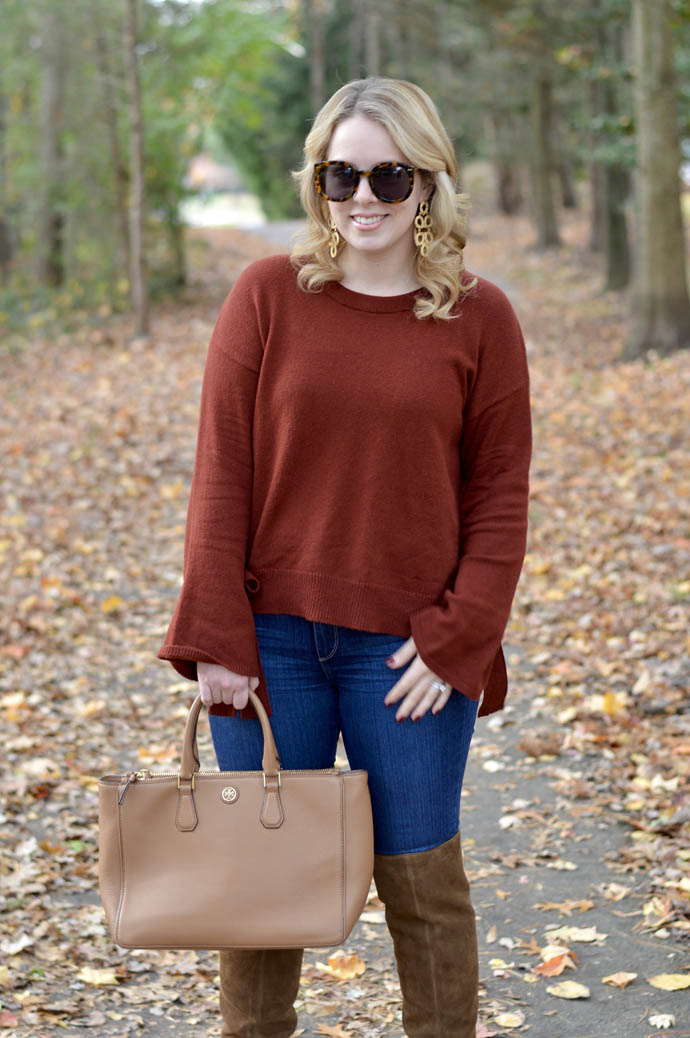 rust sweater jeans outfit
